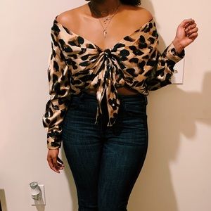 Chic boutique cheetah print wrap satin shirt. Size M